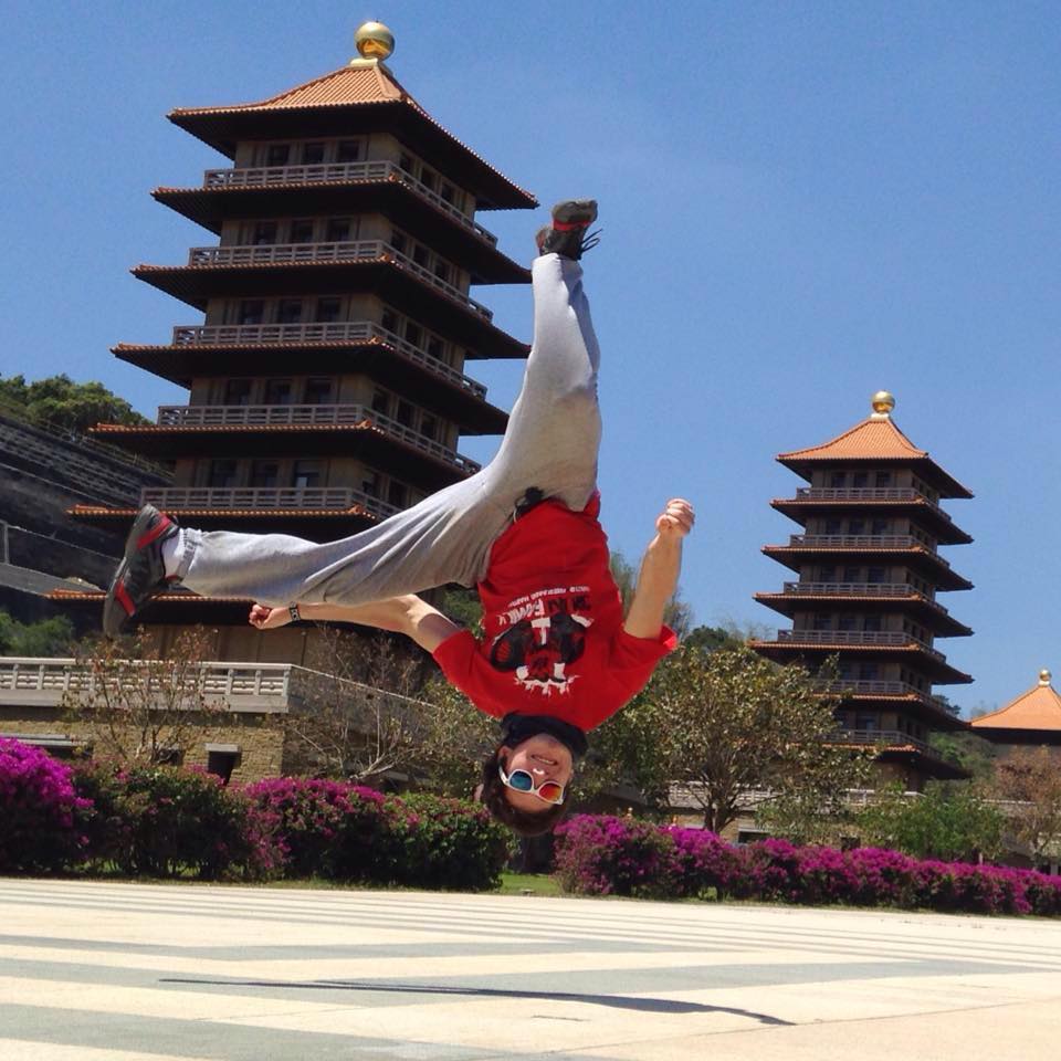 Doing martial arts acrobatics at a Buddhist temple